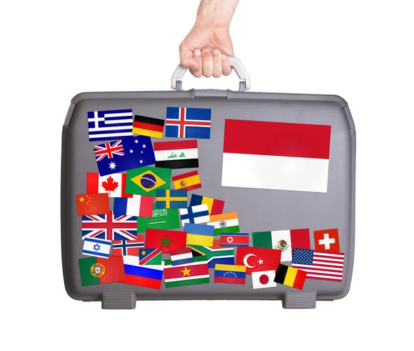 Used plastic suitcase with stickers — Stock Photo, Image