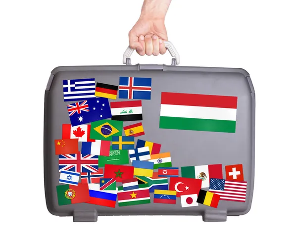 Used plastic suitcase with stickers — Stock Photo, Image