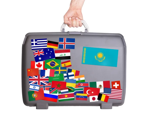 Used plastic suitcase with stickers — Stock Photo, Image