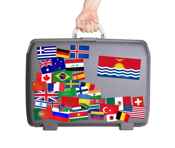 Used plastic suitcase with stickers — Stock Photo, Image