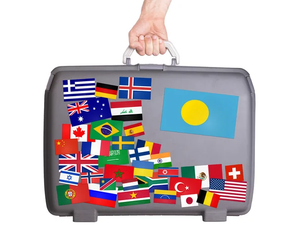 Used plastic suitcase with stickers — Stock Photo, Image