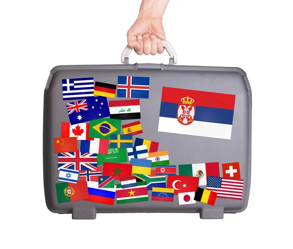 Used plastic suitcase with stickers — Stock Photo, Image