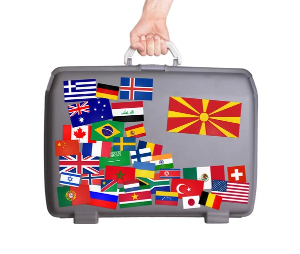 Used plastic suitcase with stickers — Stock Photo, Image