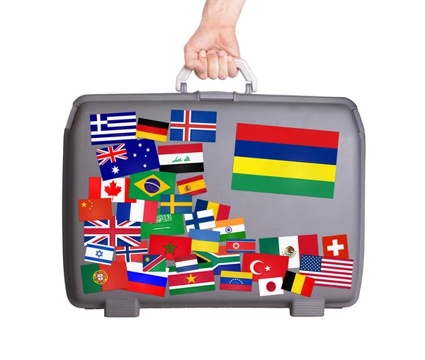 Used plastic suitcase with stickers — Stock Photo, Image