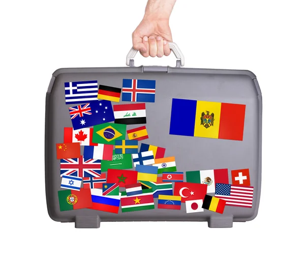 Used plastic suitcase with stickers — Stock Photo, Image