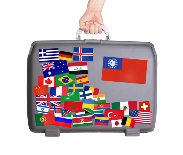 Used plastic suitcase with stickers — Stock Photo, Image