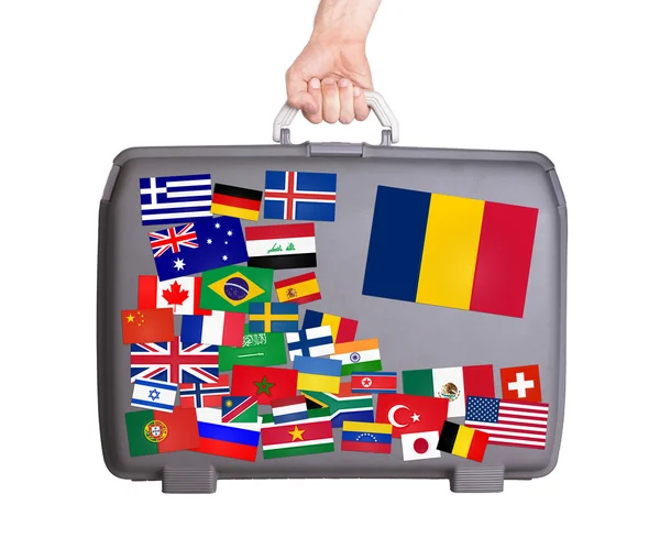 Used plastic suitcase with stickers — Stock Photo, Image