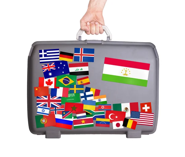 Used plastic suitcase with stickers — Stock Photo, Image