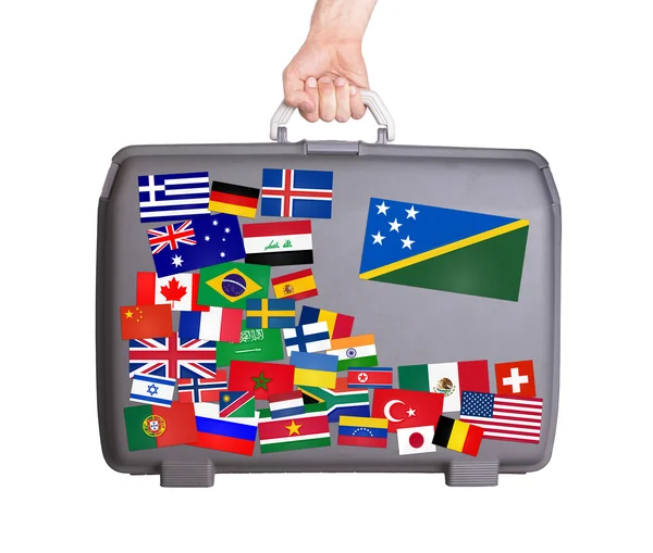 Used plastic suitcase with stickers — Stock Photo, Image