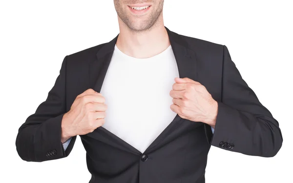 Бизнесмен открывает костюм, чтобы показать белую рубашку — стоковое фото