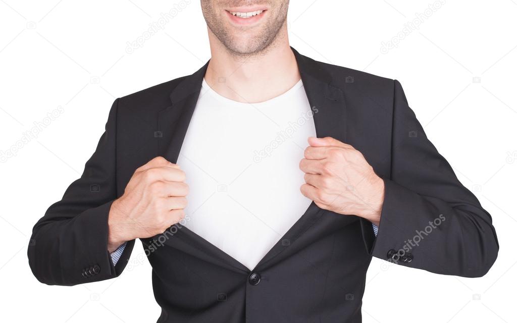 Businessman opening suit to reveal a white shirt