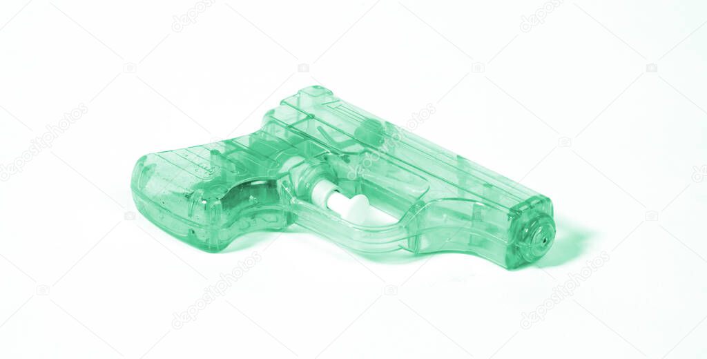 SImple green small water pistol isolated on white background