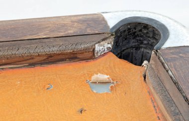 Old broken orange pooltable outside, selective focus
