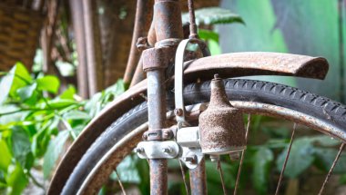 Old bicycle found in nature, selective focus on dynamo