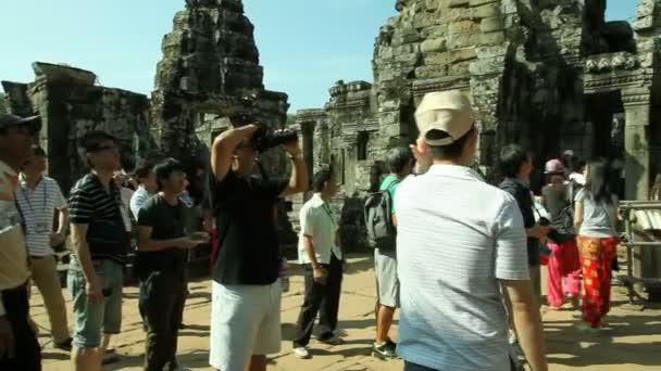 Tourists are visiting Bayon Temple in Angkor, Siem Reap in Cambodia — Stock Video