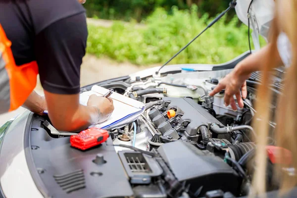 Closeup and crop auto repair post a list of repairs according to customer orders on blurred background.