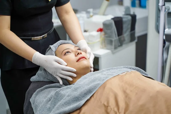 Cosmetics nurse hands in a gloves with preparation for procedure perfect skin, spa and care