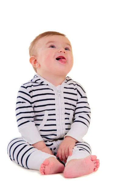 Bambino sorridente seduto — Foto Stock