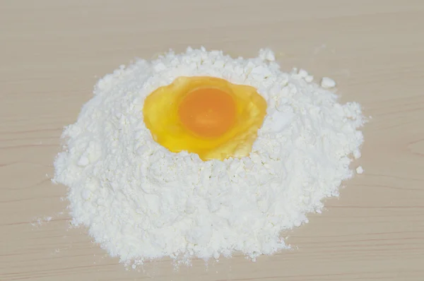 Egg yolk on flour — Stock Photo, Image