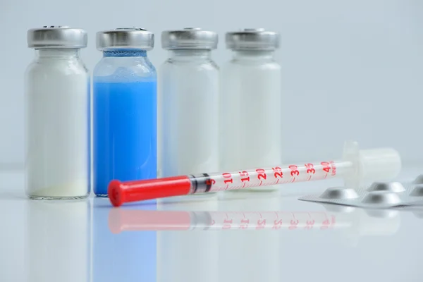 Syringes pills and vials — Stock Photo, Image