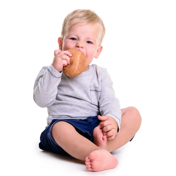 Baby eats bread — Stock Photo, Image