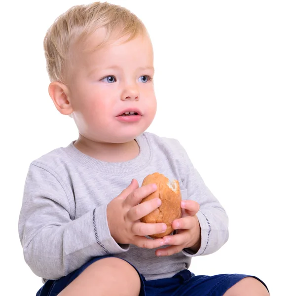 Baby eats bread — Stock Photo, Image