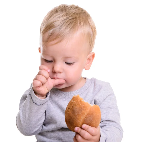 Baby eats bread — Stock Photo, Image