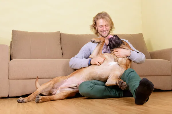 Man with big dog — Stock Photo, Image