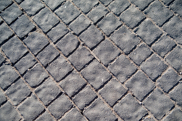 Fragment of cobblestoned pedestrian sidewalk in Jerusalem
