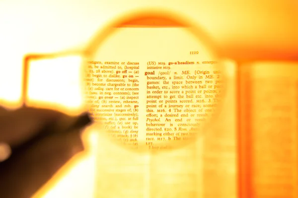 A magnifying glass on the word goal — Stock Photo, Image