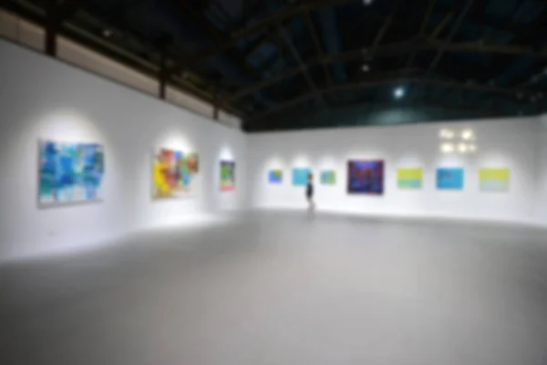 People Looking Paintings White Wall Art Exhibition Gallery Blurry Background — Stock Photo, Image