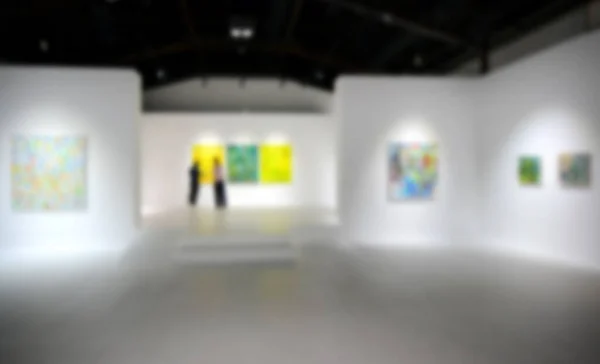 People Looking Paintings White Wall Art Exhibition Gallery Blurry Background — Stock Photo, Image