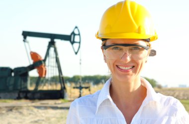Smiling Female Engineer in an Oilfield