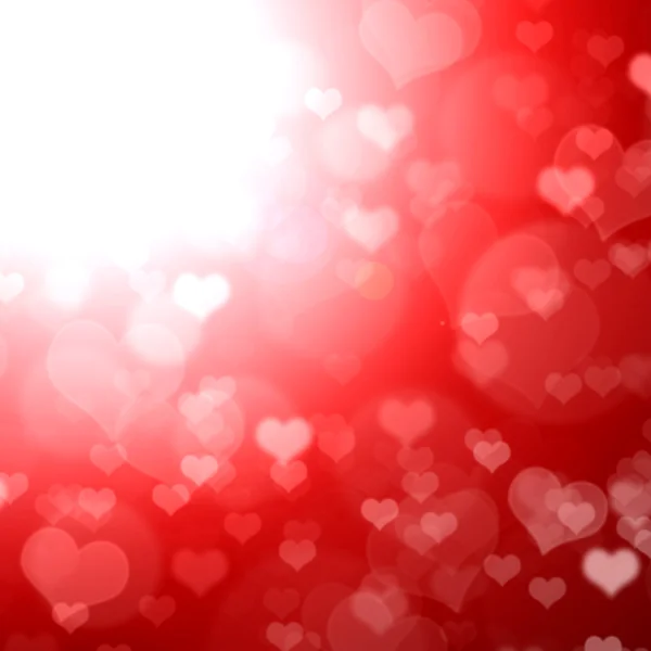 Rot glänzender Hintergrund mit Herzen. — Stockfoto