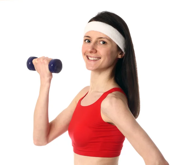 Happy young woman exercising with a dumbbell — Stock Photo, Image