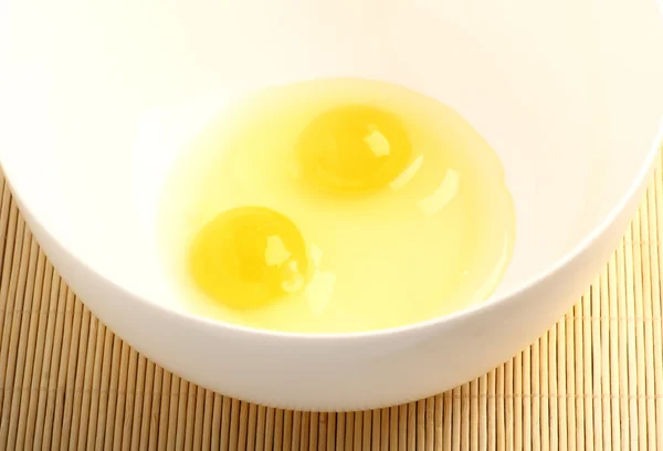 Eggs in a white bowl — Stock Photo, Image