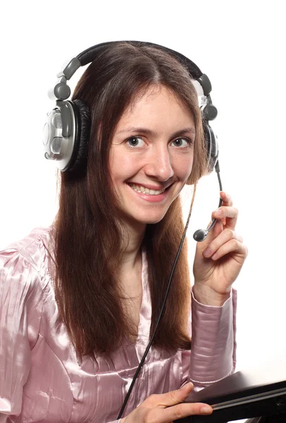 Attractive smiling young woman with headphones and laptop — Stock Photo, Image