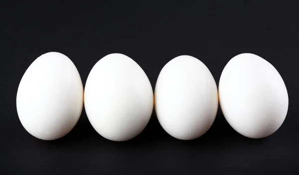 Eggs isolated on black background — Stock Photo, Image
