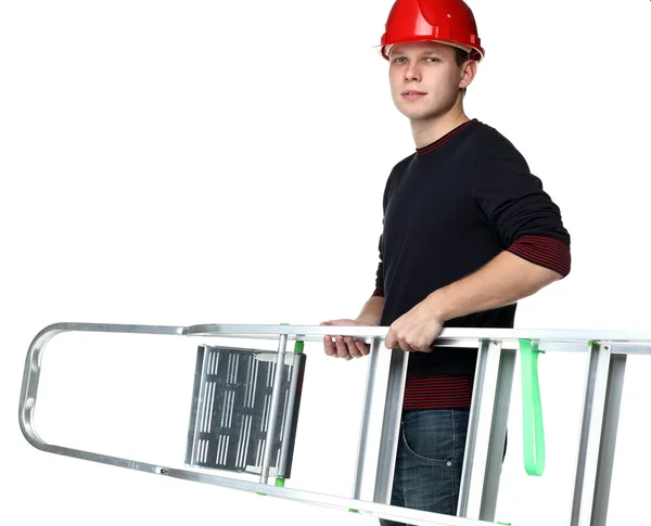 Young man in red hard hat holding stepladder — Stock Photo, Image