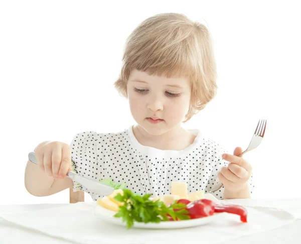 Kleines Mädchen isst ihr Abendessen — Stockfoto