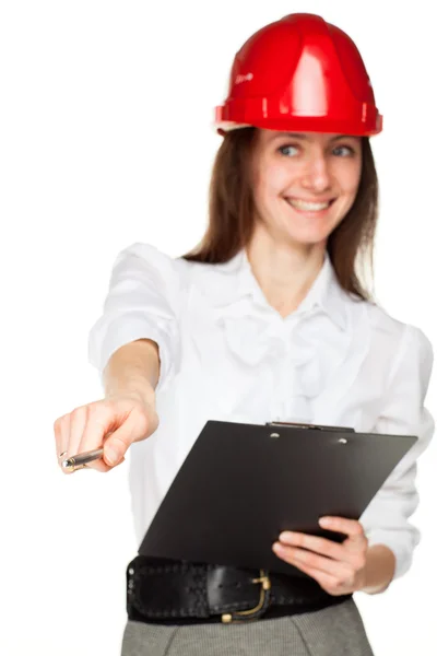 Smiling young woman in red hard hat — Stock Photo, Image