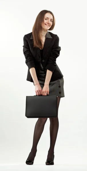 Attractive happy young businesswoman with briefcase — Stock Photo, Image