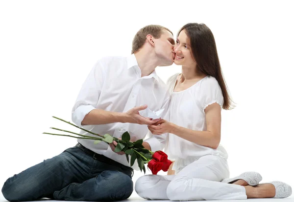 Guy kissing his smiling girlfriend — Stock Photo, Image