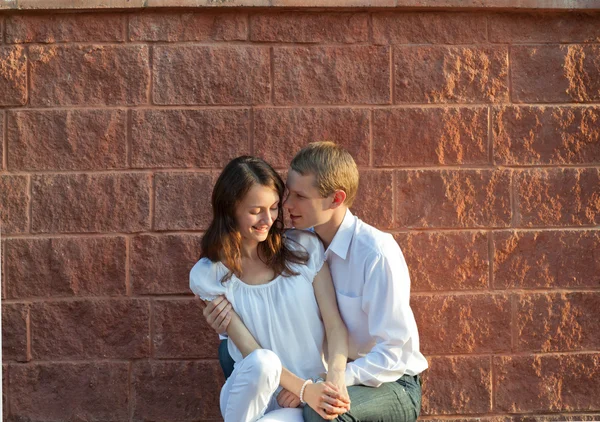 Beautiful couple in love sitting together — Stock Photo, Image