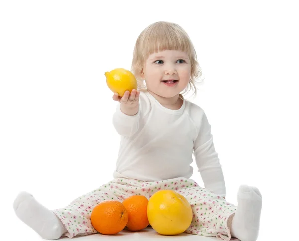 The baby girl with fruits — Stock Photo, Image