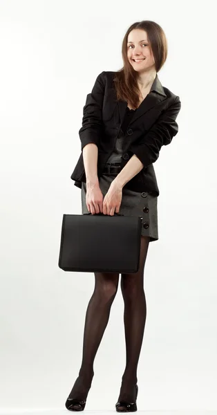 Atractiva joven empresaria feliz con maletín — Foto de Stock