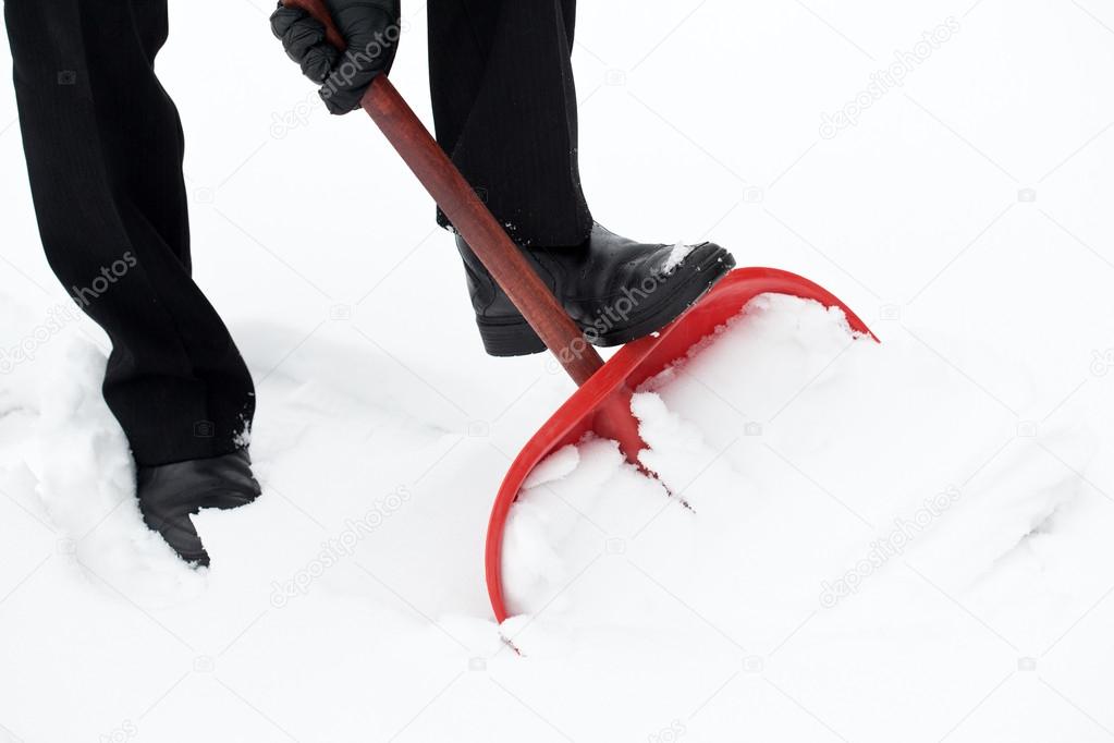 Removing snow with a shovel