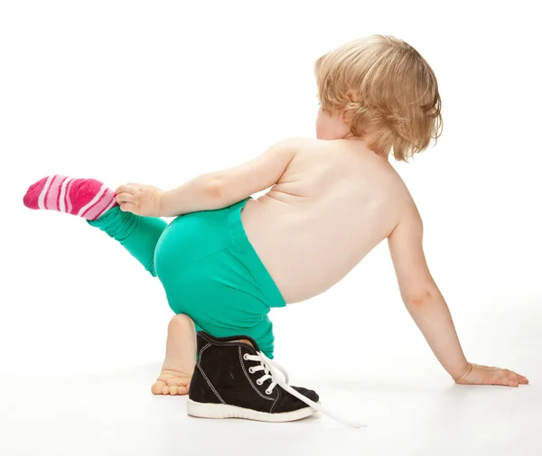 Little child getting undressed — Stock Photo, Image