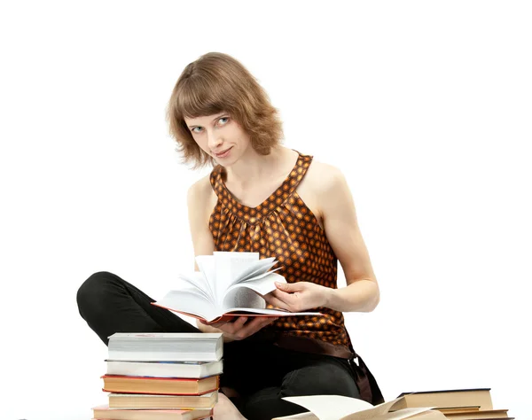 Beautiful smiling young student studying sitting on the floor — Stock Photo, Image