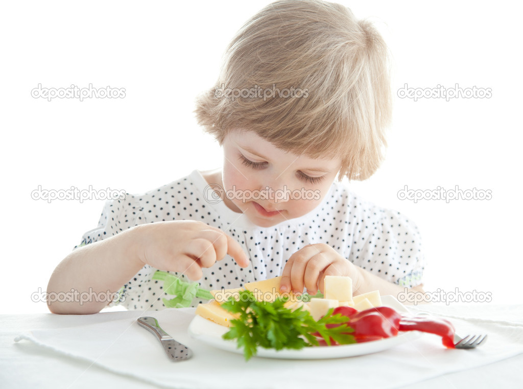 Little girl eating her dinner